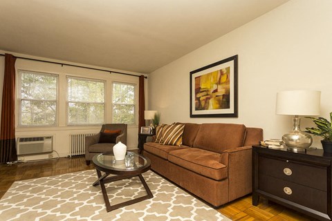 a living room with a couch and a table