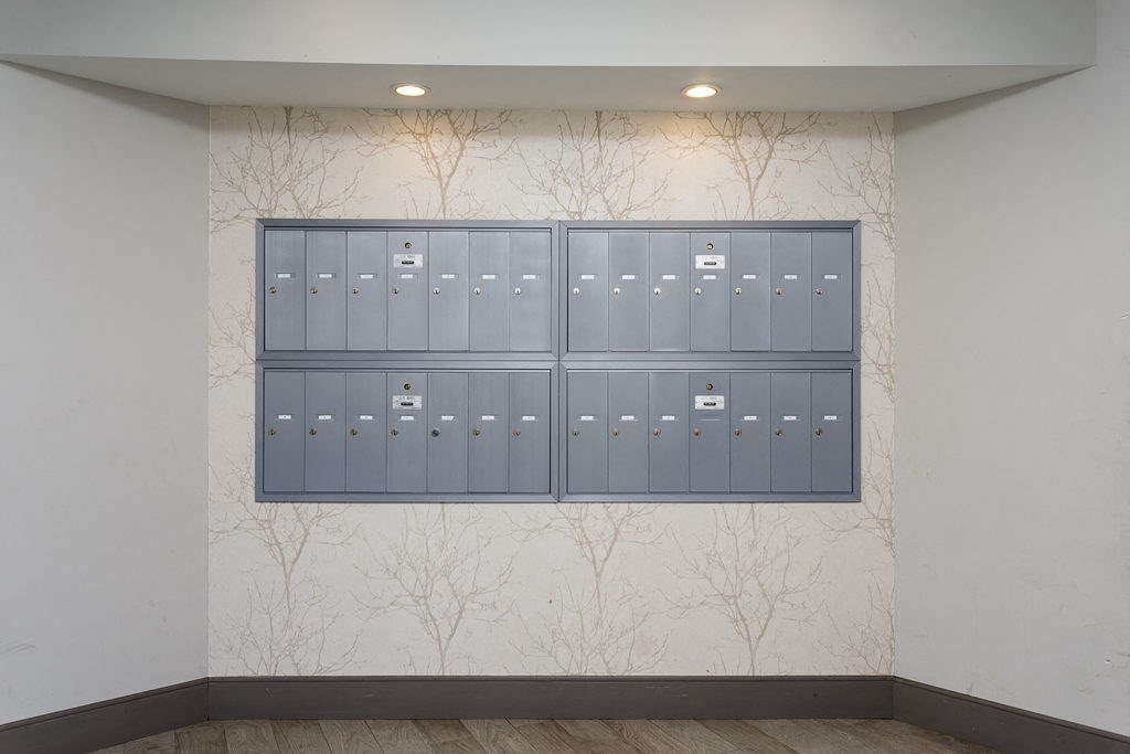 a wall of lockers in a building with trees on it