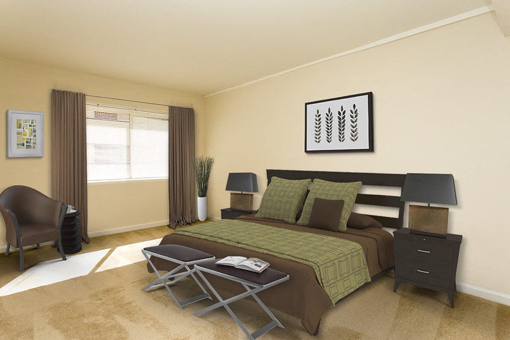 a bedroom with a bed and a chair