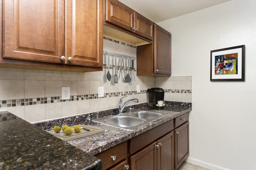 a kitchen with granite counter tops and a sink