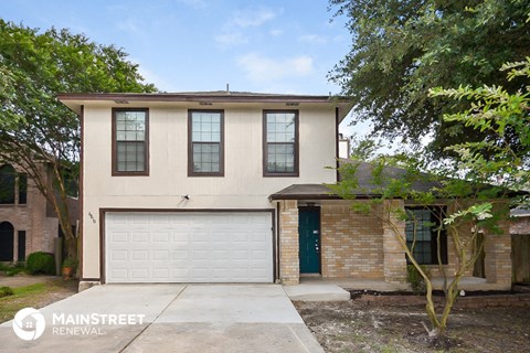 a house with a white garage door in front of it