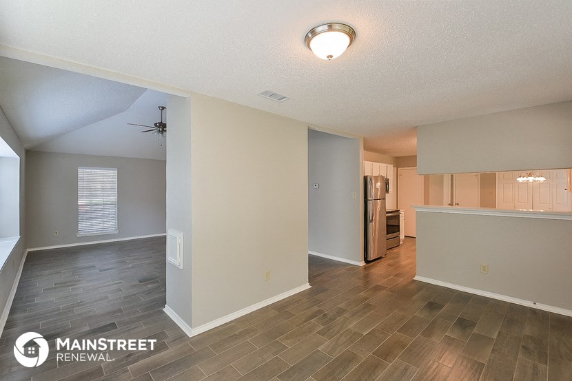 the living room and kitchen of an apartment