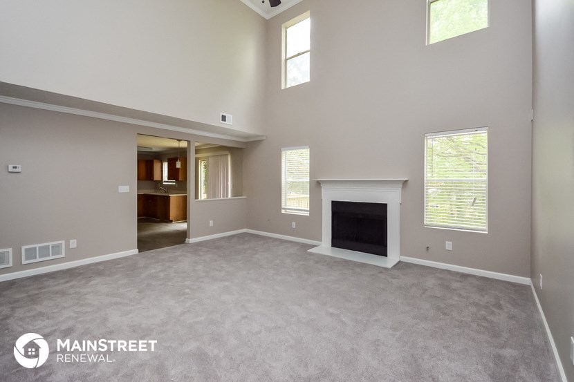 the living room of a home with a fireplace
