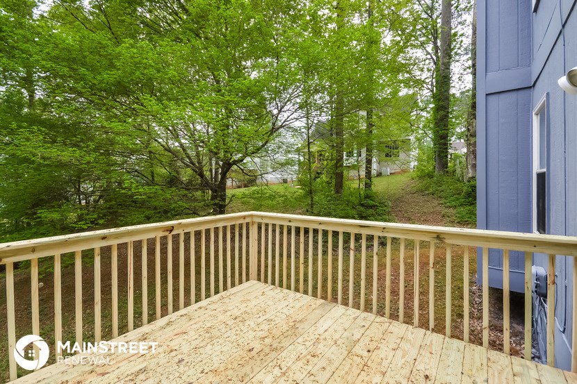 a deck with a view of the woods