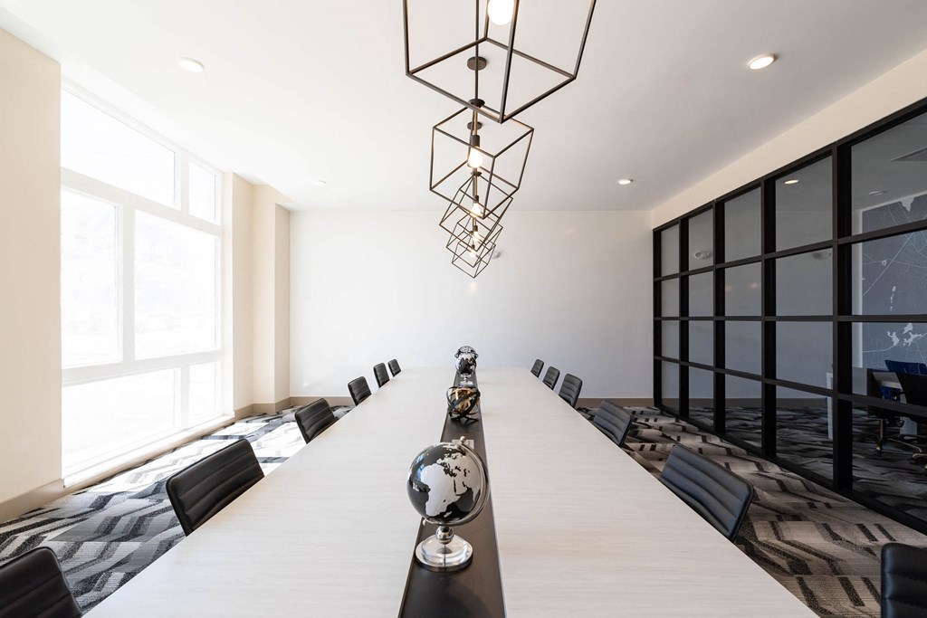 a conference room with a long table and chairs
