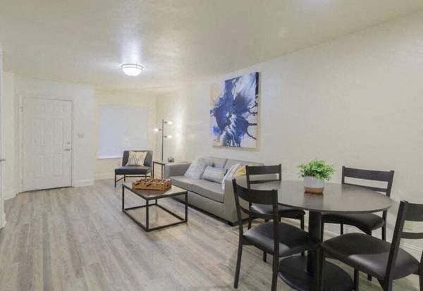 a living room with a table and a couch
