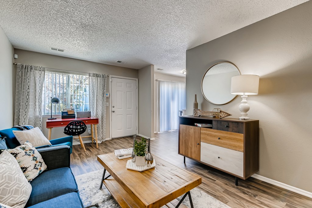 an open living room with a couch and a coffee table