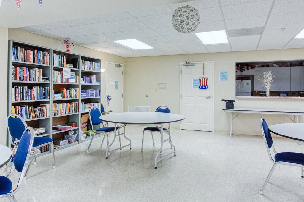large library with tables and chairs set up for reading