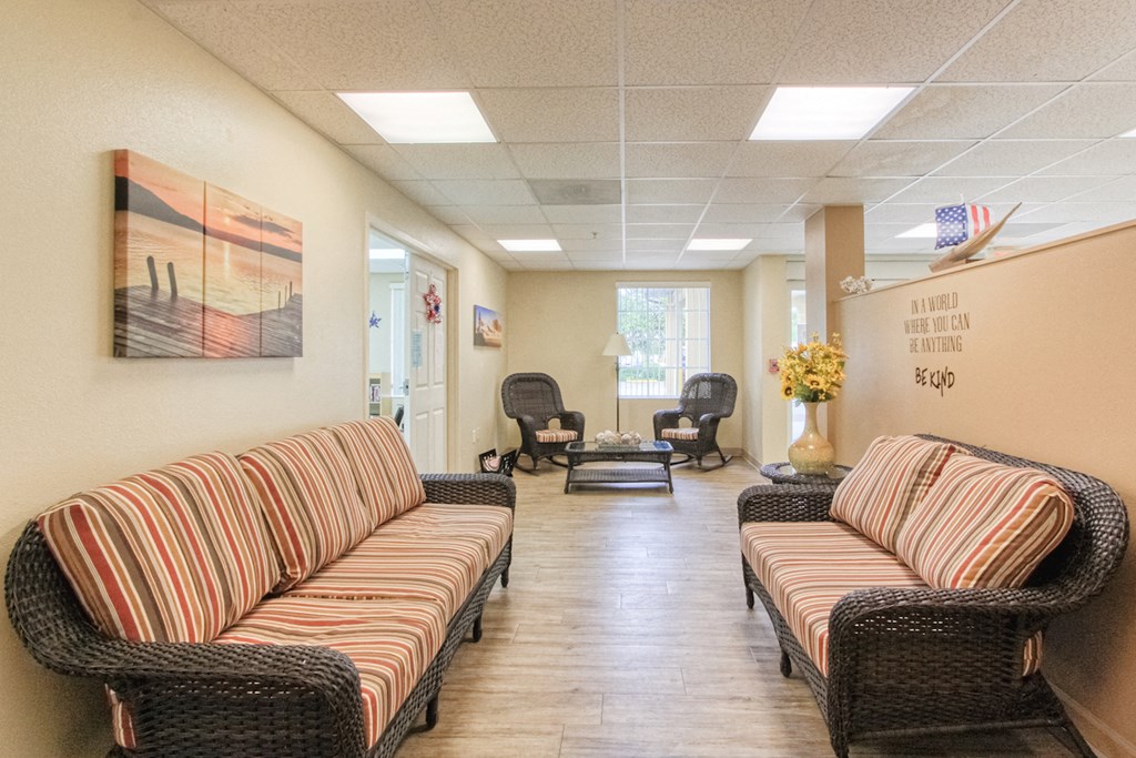 Lobby with comfortable couches and chairs and Holy Cross Manor I