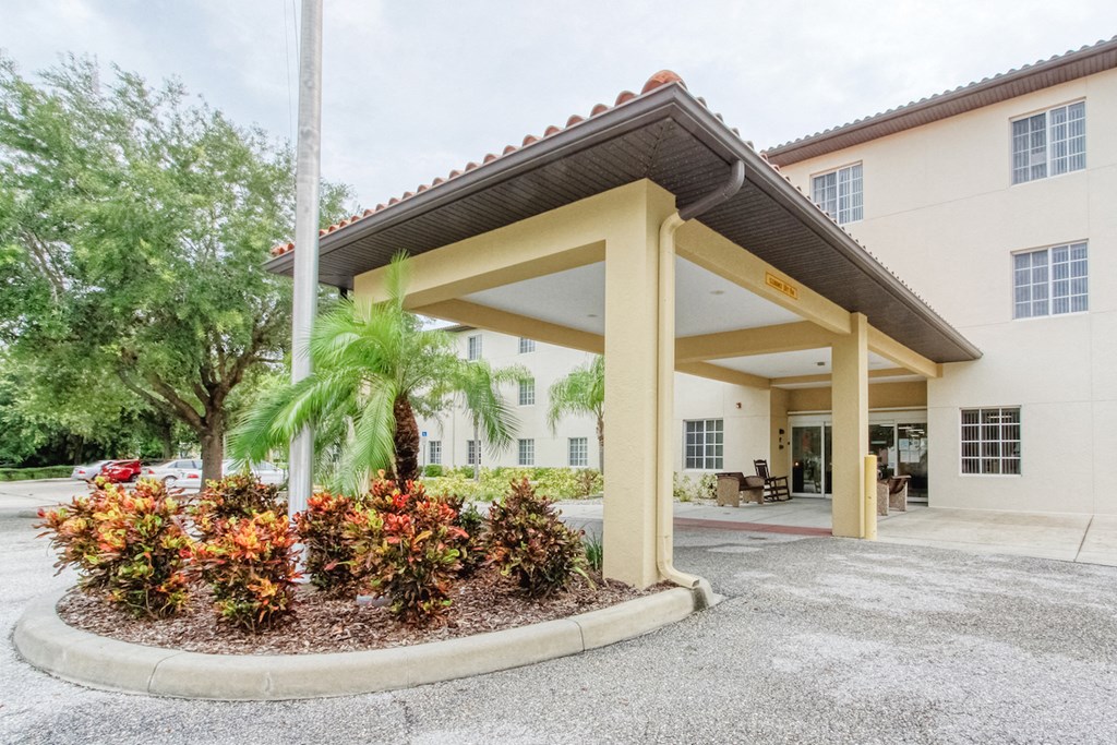 landscaped circular drive and covered entrance to Holy Cross Manor I