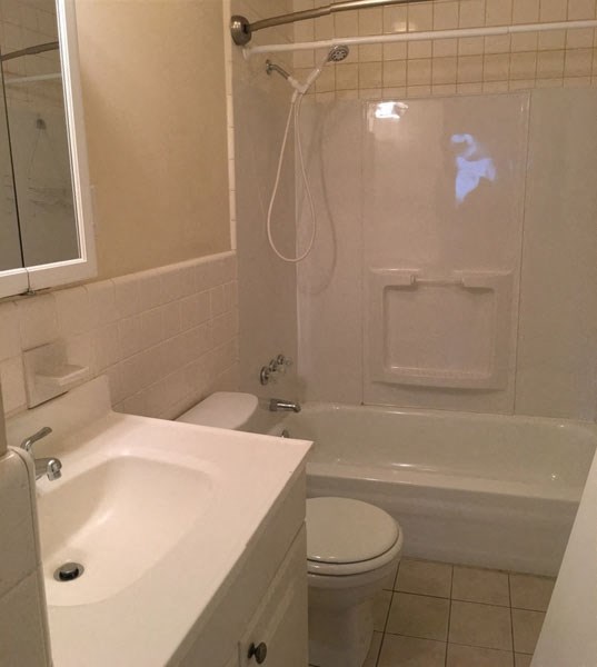 a bathroom with a sink toilet and a tub