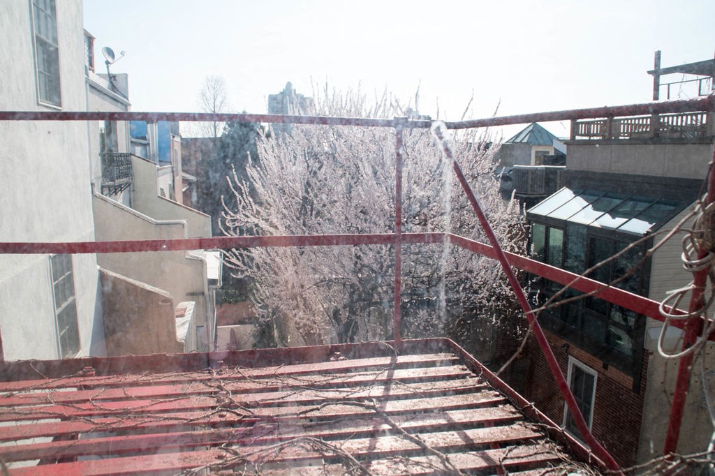 a view of the city from the top of a roof