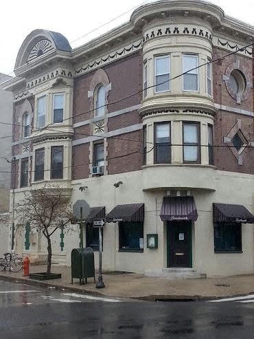 a building on the corner of a city street