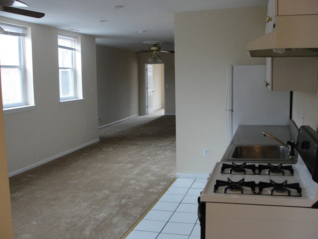 an empty kitchen and living room in a house