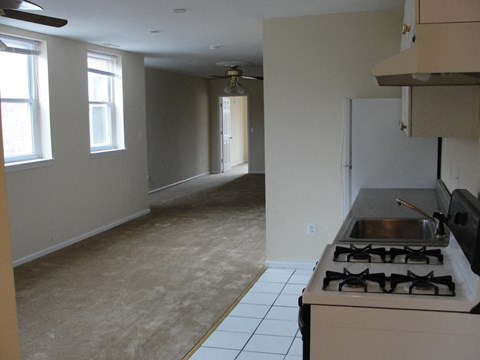 an empty kitchen and living room in a house