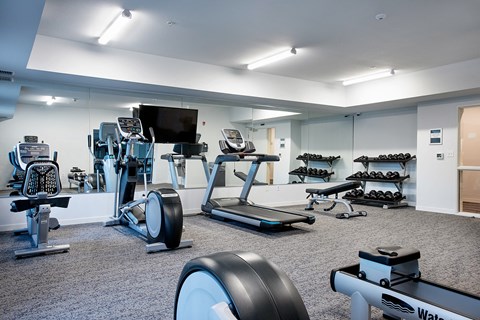 a large fitness room with treadmills and other exercise equipment at EastGate Apartments, Rochester, Minnesota
