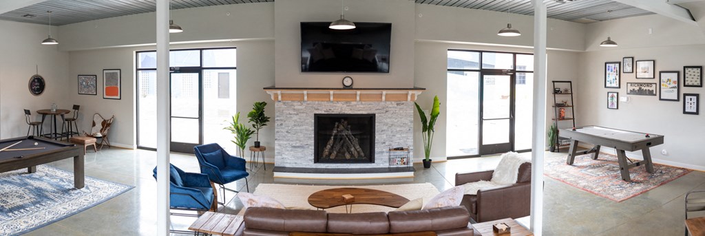 a living room with a fireplace and a pool table at Scott's View, Richmond, VA 23230