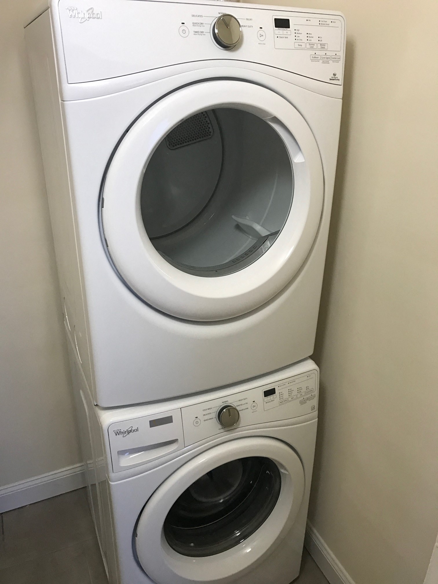 a washing machine and dryer in a laundry room