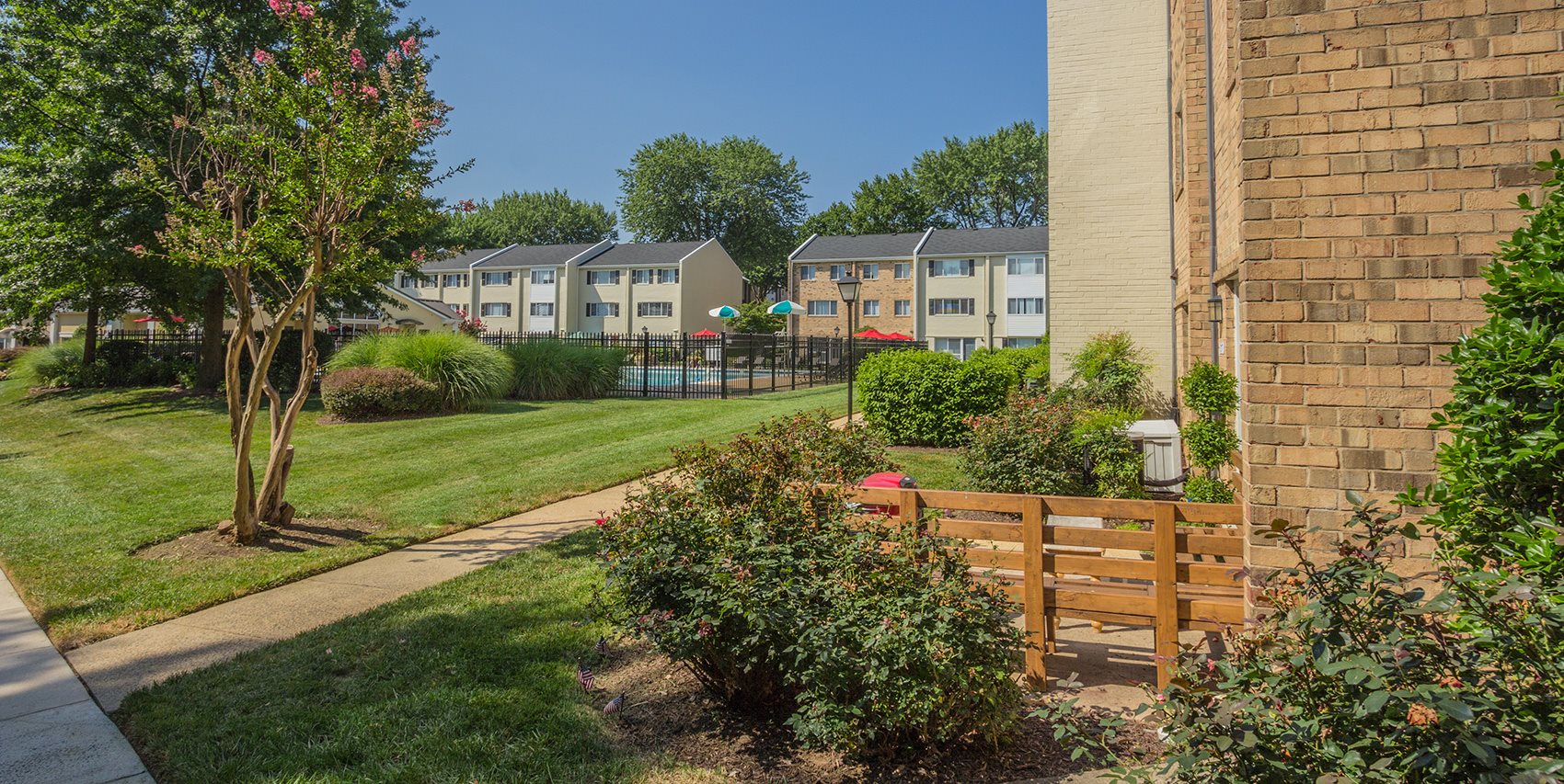 Apartments In Falls Church Va Tysons Glen Townhomes View Of Walkway On The Premise With Nice Landscaping At Apartment Complex