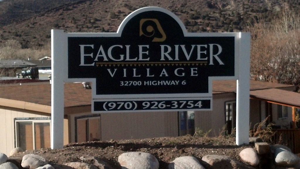 a sign for eagle river village