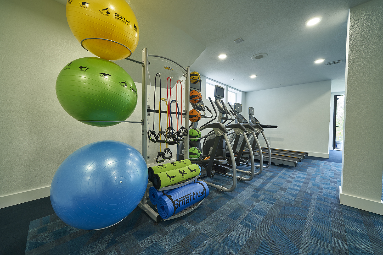 modern interior of apartment building with workout equipment