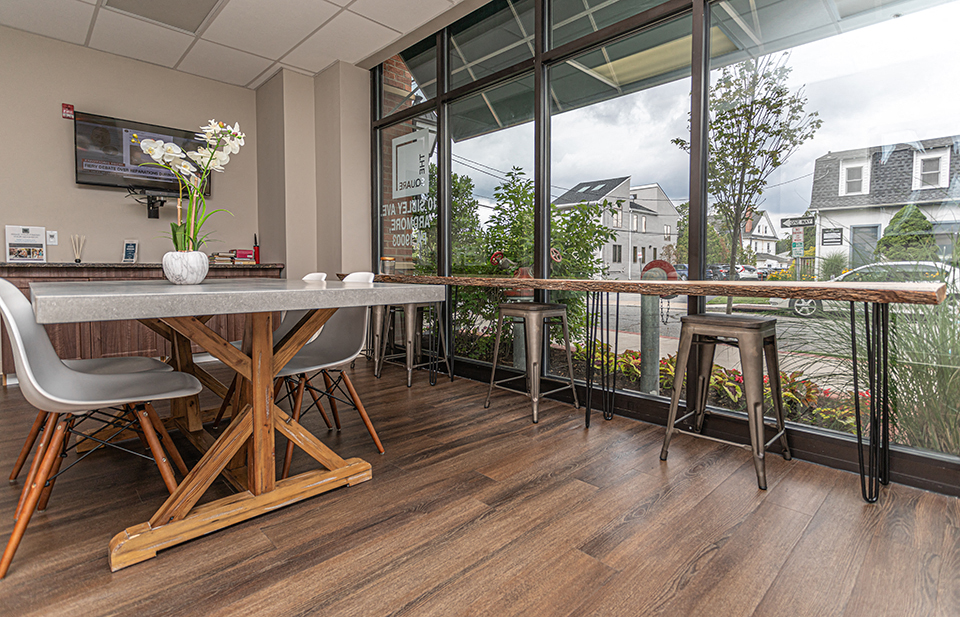 Spacious community area with ample seating for working from home in luxury apartment building