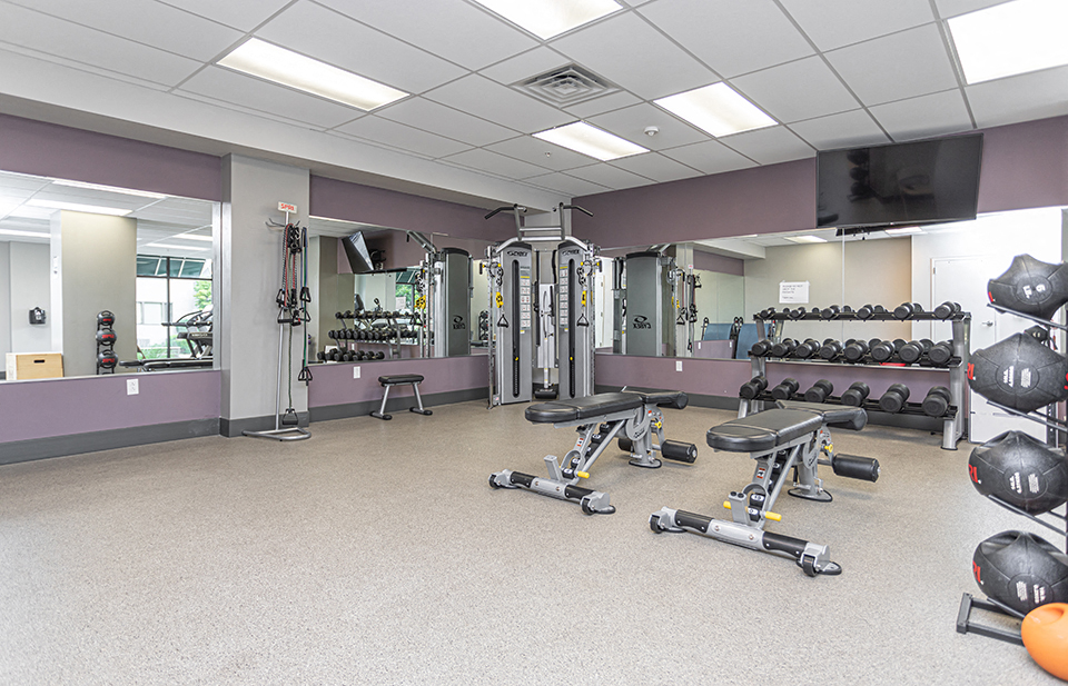 Apartment fitness center with strength training equipment at luxury apartments for rent in Ardmore, PA
