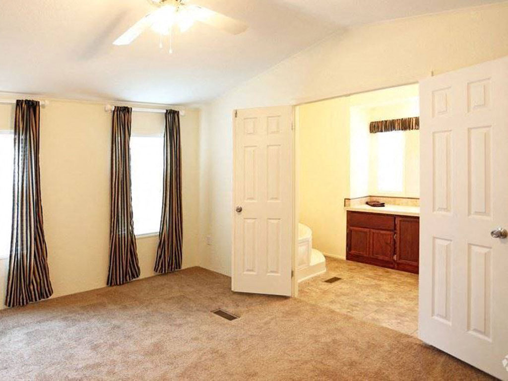 Master Bedroom With Double Doors at Heritage Oaks Rental Homes in Lincoln, NE