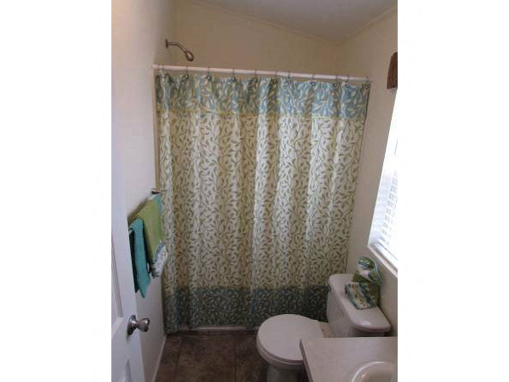 Bathroom Shower With Curtain at Heritage Oaks Rental Homes in Lincoln, NE