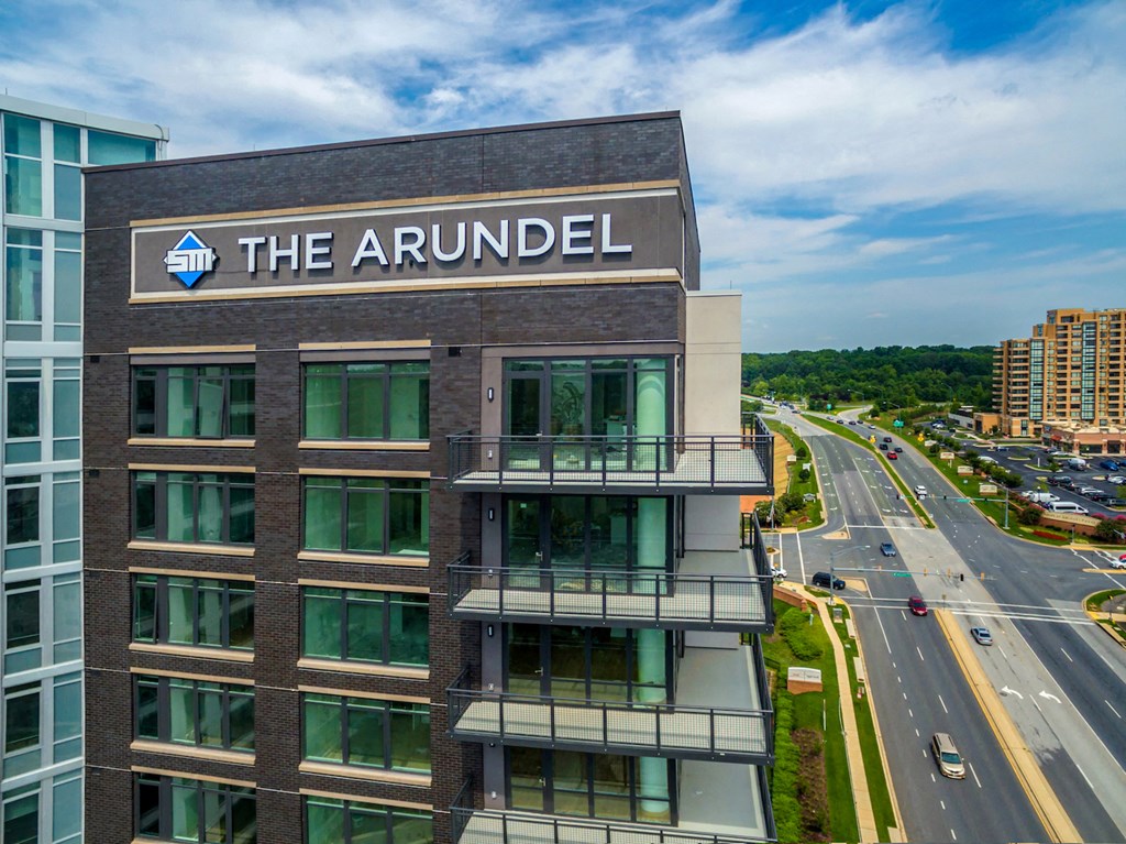 a large building with the arundel on top of it next to a highway