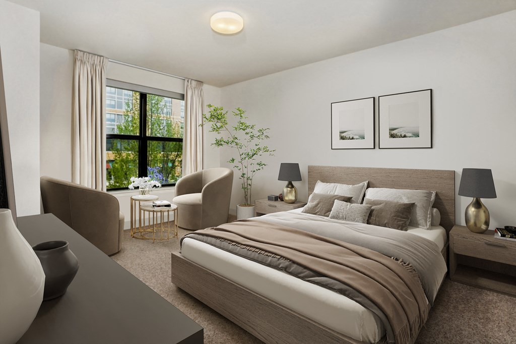 a bedroom with a bed and a desk and a window