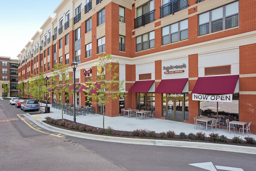 a building on a city street with cars parked