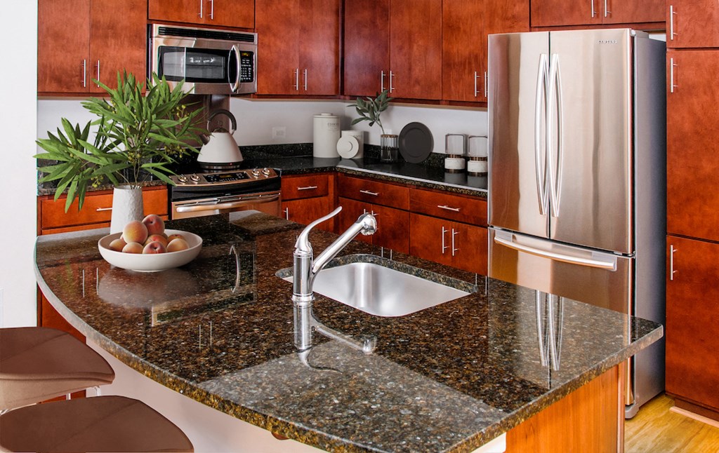 a kitchen with granite counter tops and a sink