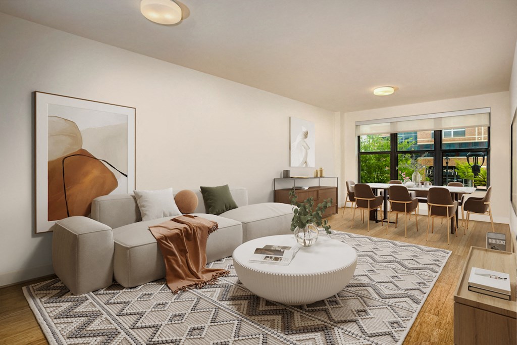 a living room with a white couch and a coffee table