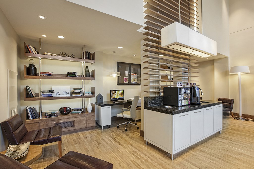 a lobby with a coffee bar and a desk with a computer