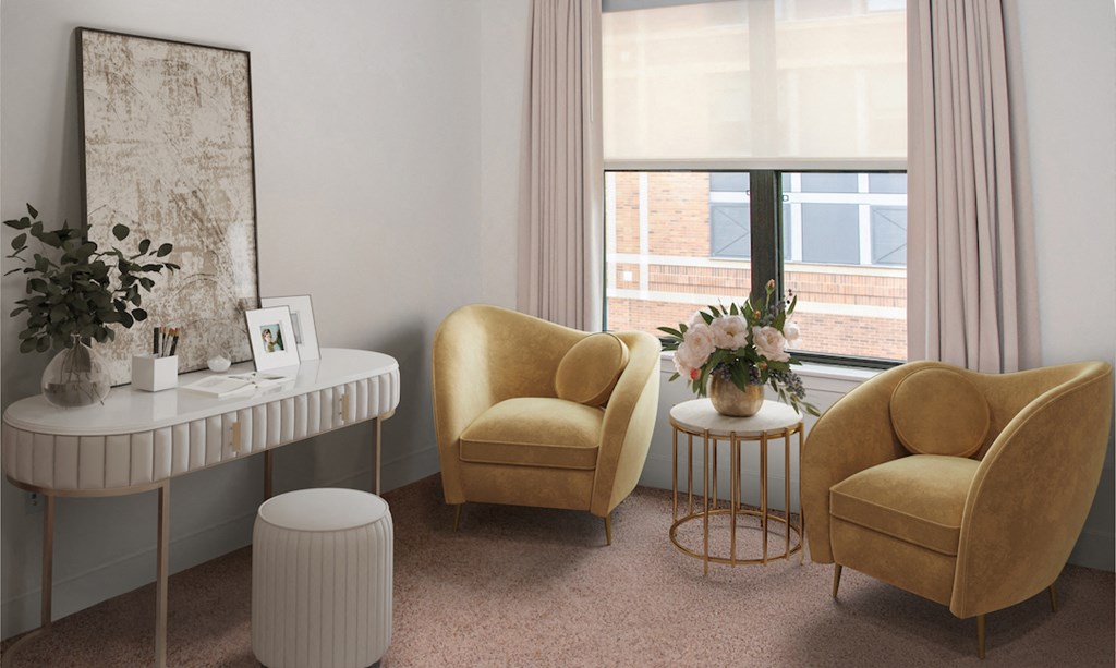 a living room with two yellow chairs and a table and a window
