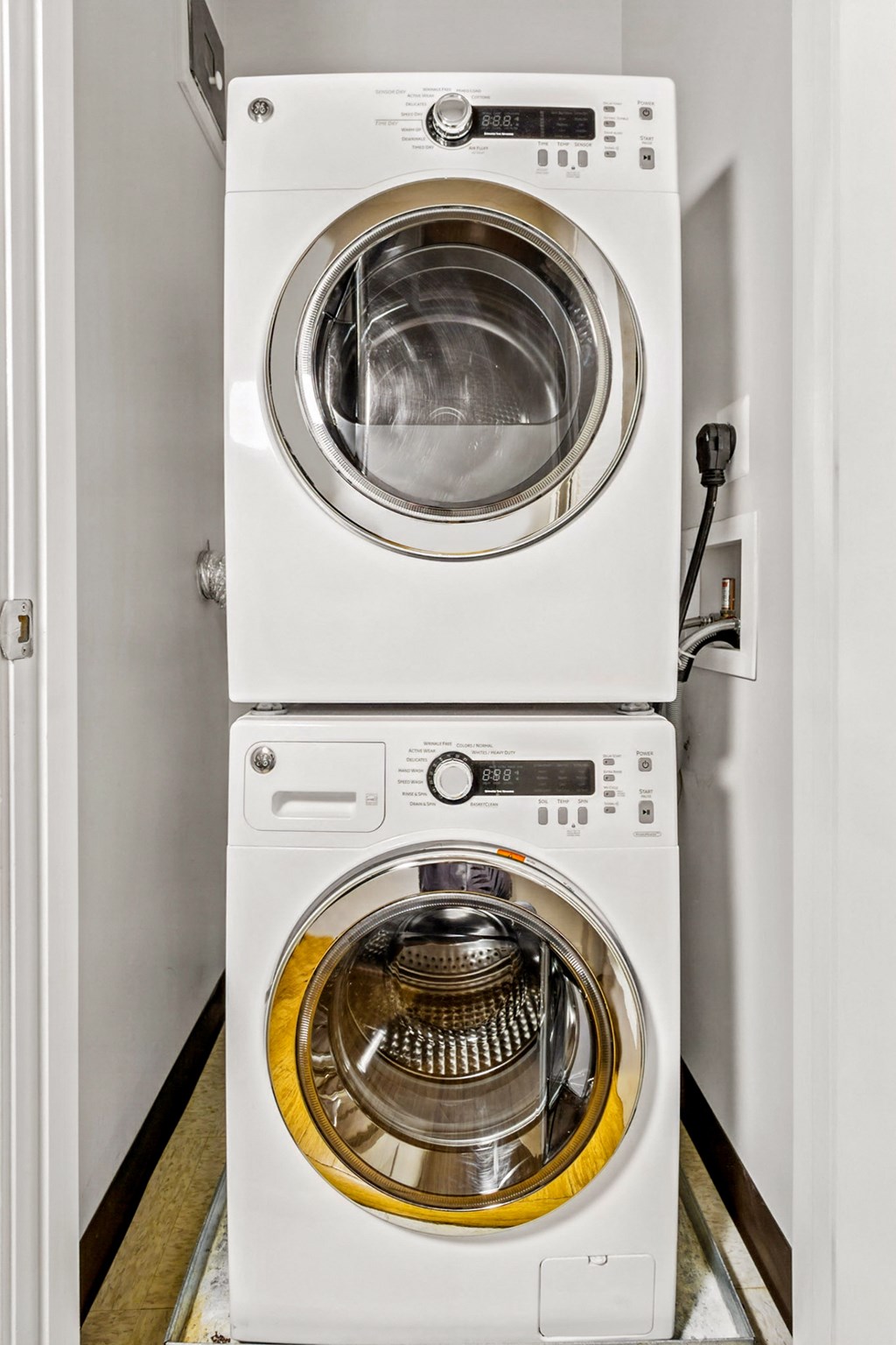 a front loading washer and dryer in a laundry room