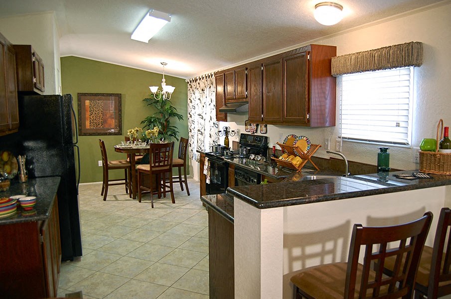 a kitchen and dining room with a counter top