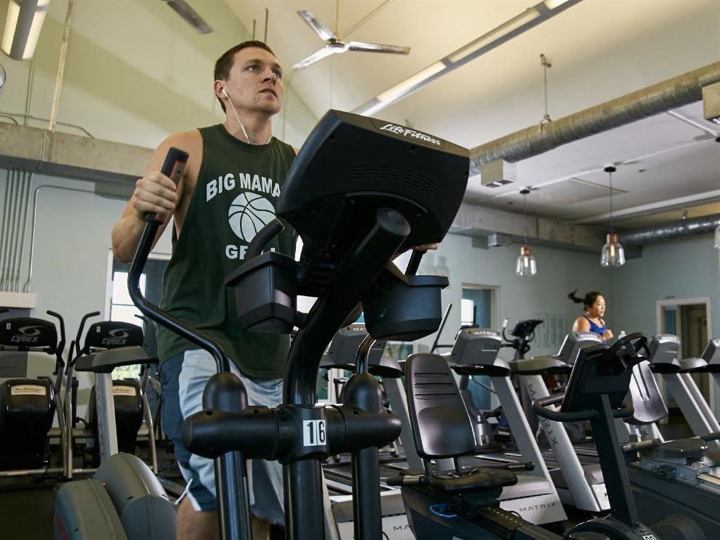 a man working out on a treadmill at the gym