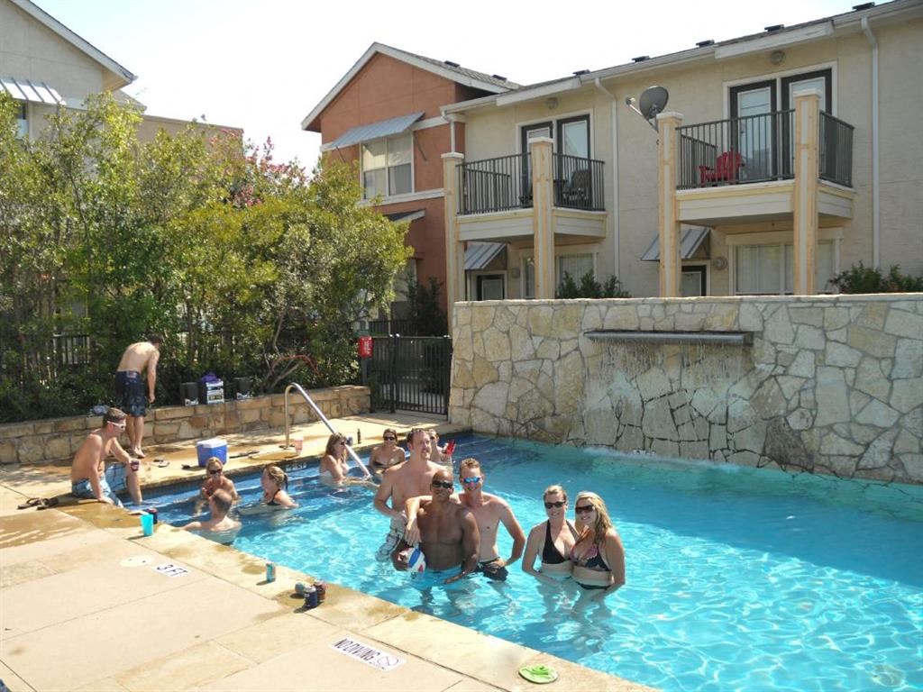a group of people playing in a swimming pool