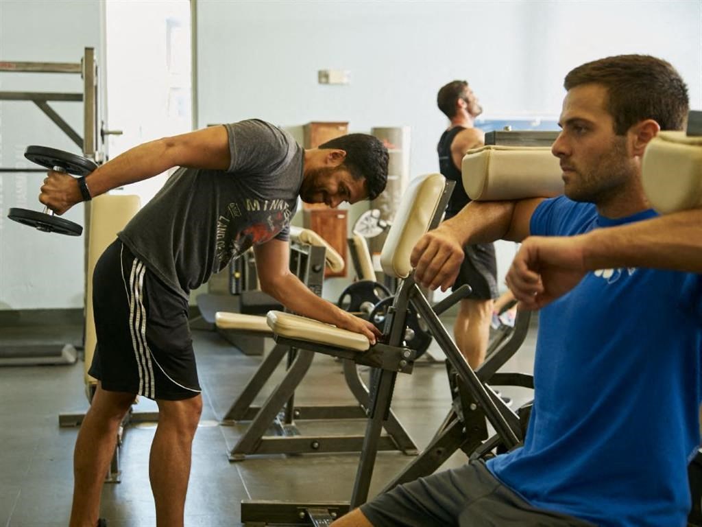 a group of men working out at a gym
