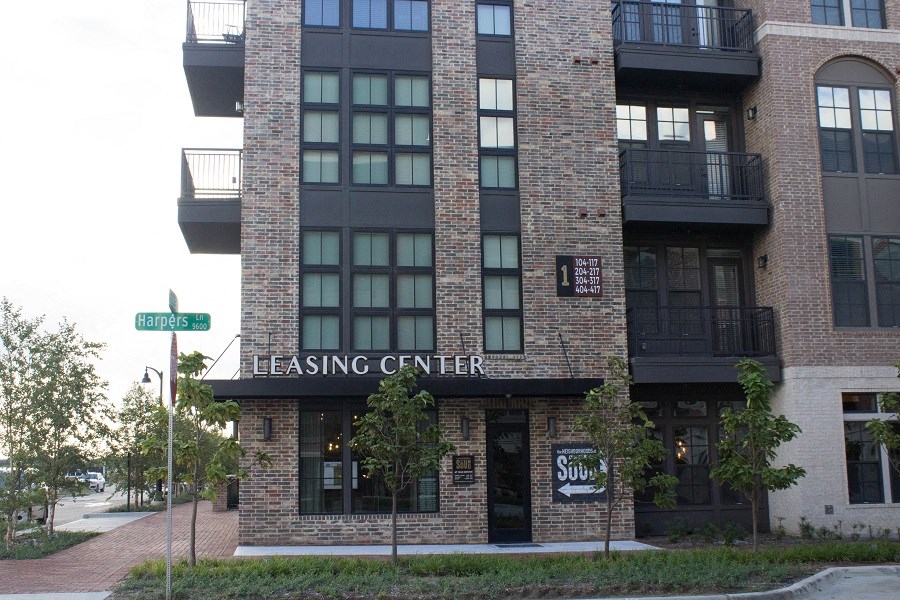 the exterior of the leasing center on the corner of a building