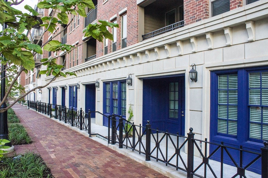 a row of blue doors on the side of a building
