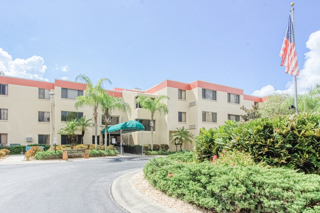 circular drive with lush landscaping in front of Villa San Carlos