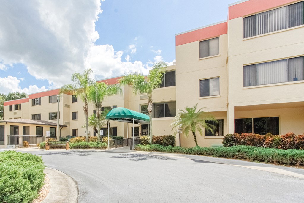 VSC-Exterior2 circular drive with covered entrance to Villa San Carlos Senior Apartments