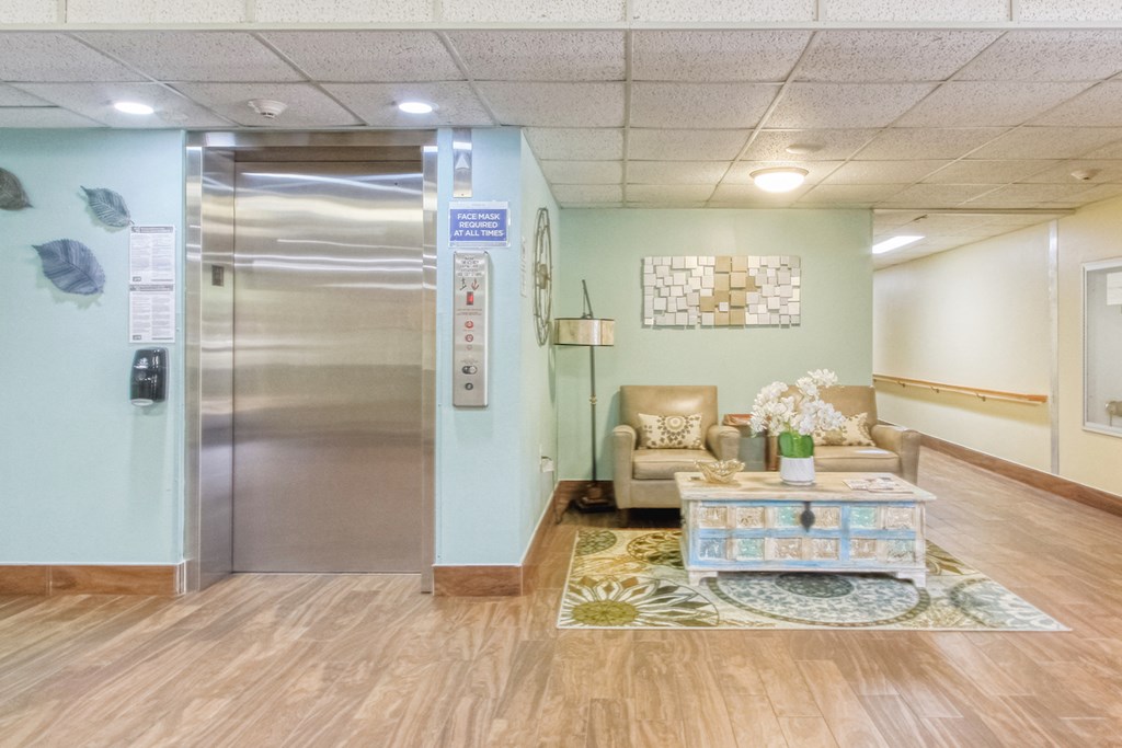 elevator bay with comfortable seating nearby