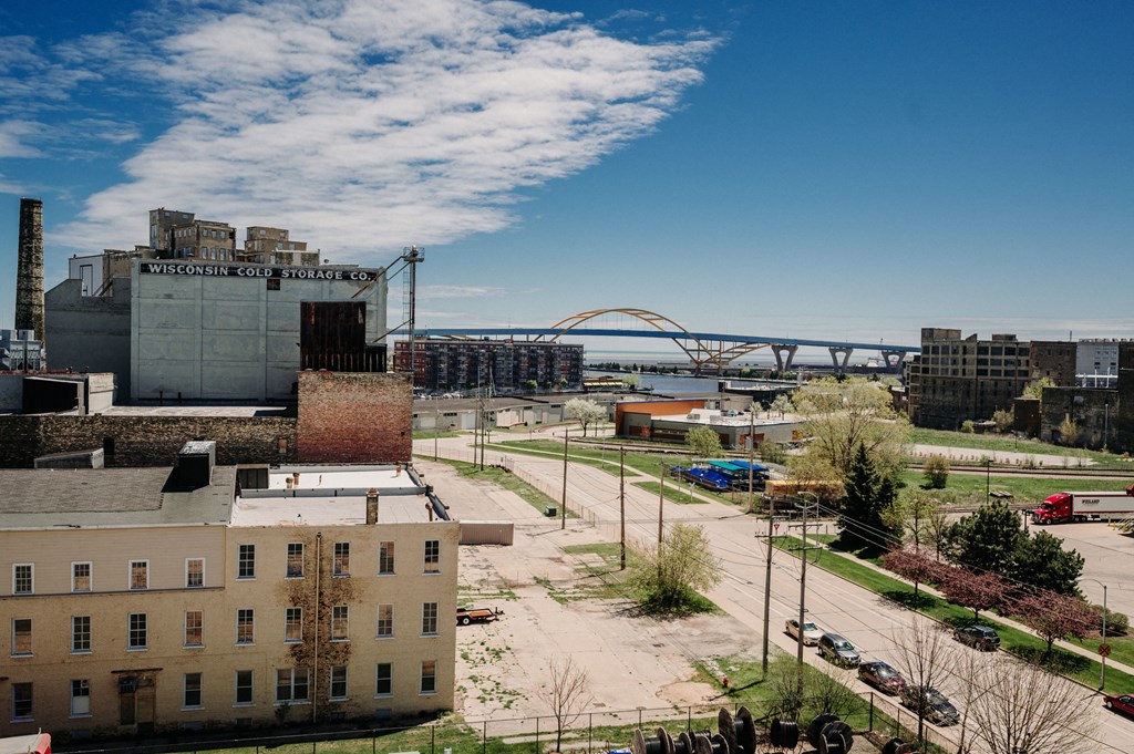 a view of the city with a bridge in the background