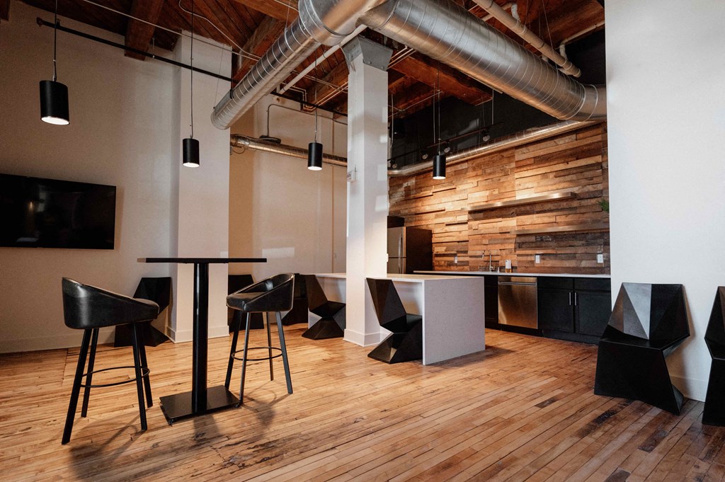 a dining room with tables and chairs in a loft