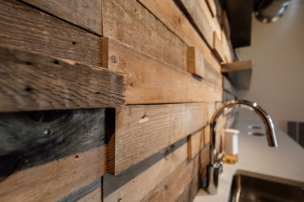a wall of reclaimed wood in a kitchen