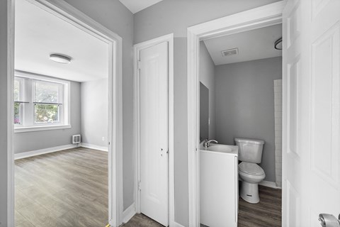 A bathroom with a toilet and a sink.